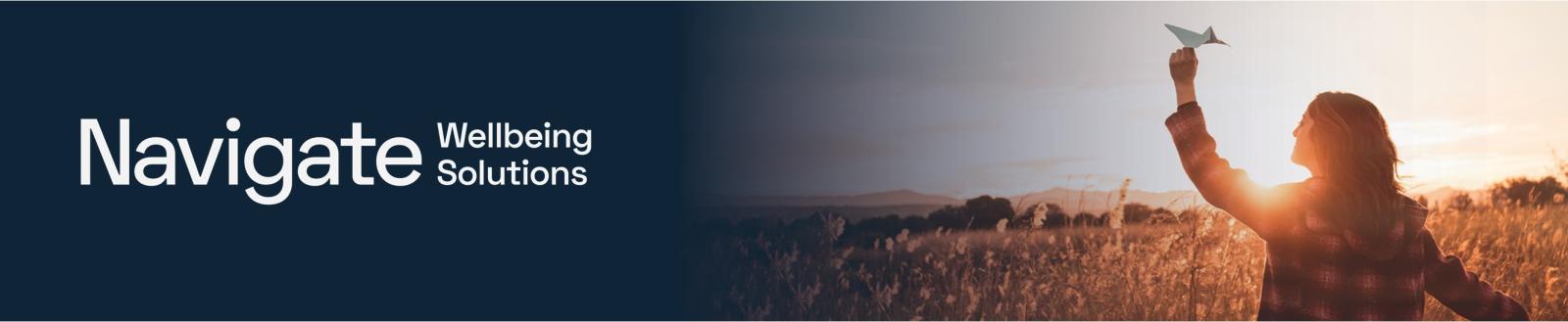 Navigate Wellbeing Solutions, picture shows women in a field with a paper airplane with sunset in the background