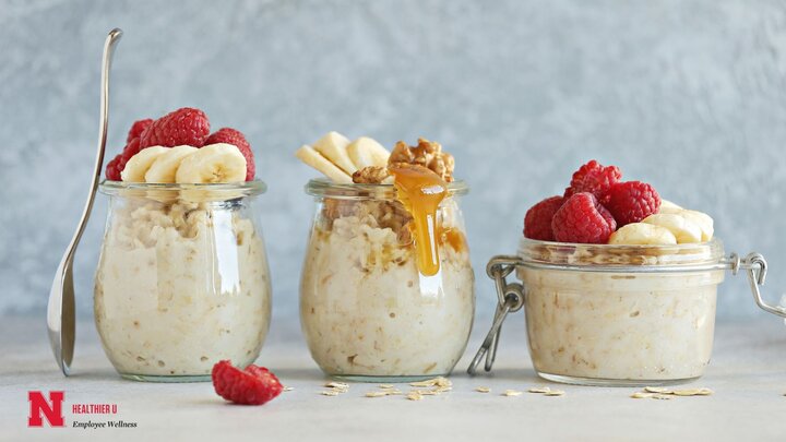 Overnight Oats with fruit and honey on top, in glass jars