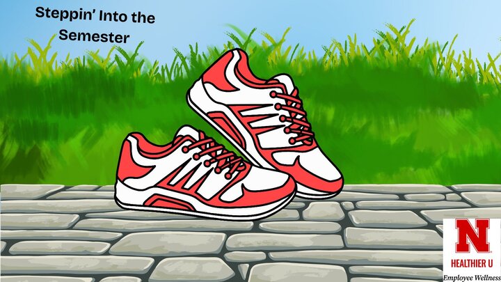 Red and white sneakers stepping on rock pathway in front of grass