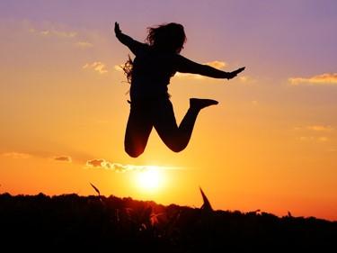 Jumping in joy in the sunset